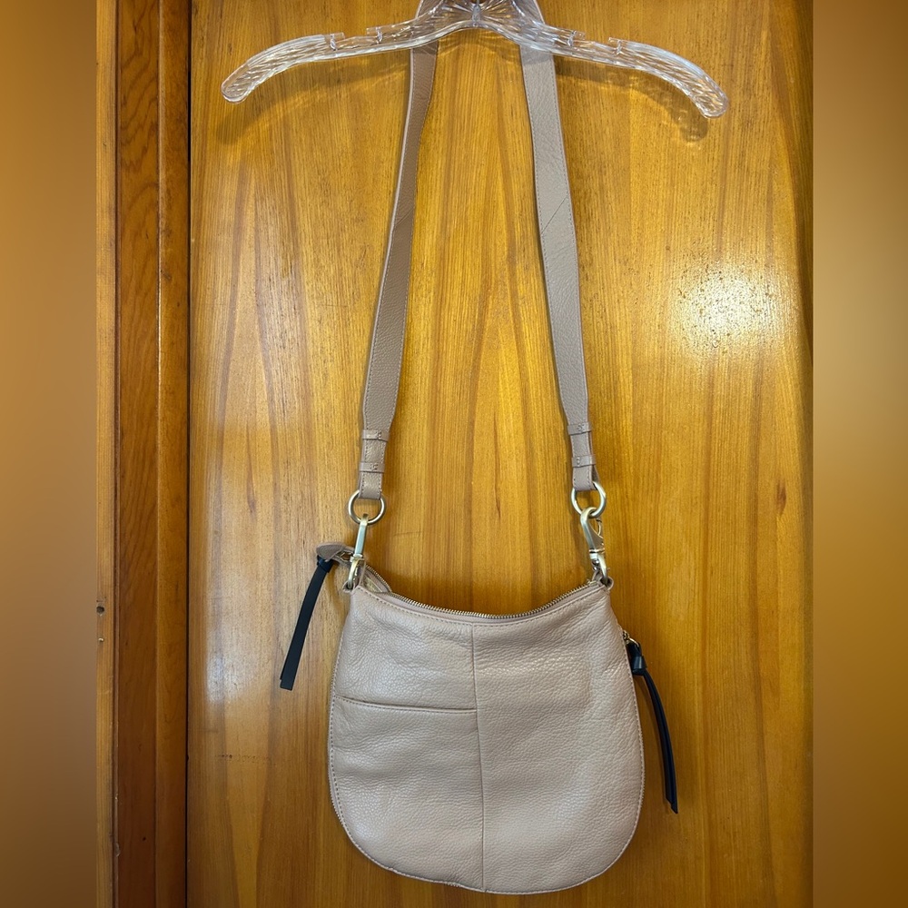 Tan satchel with zipper side expansion